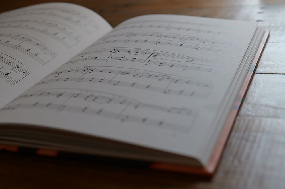 Sheet music lying open on a wooden table