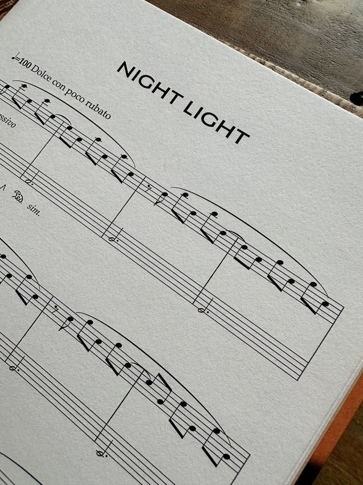 A printed page of Night Light sheet music showing the title piece